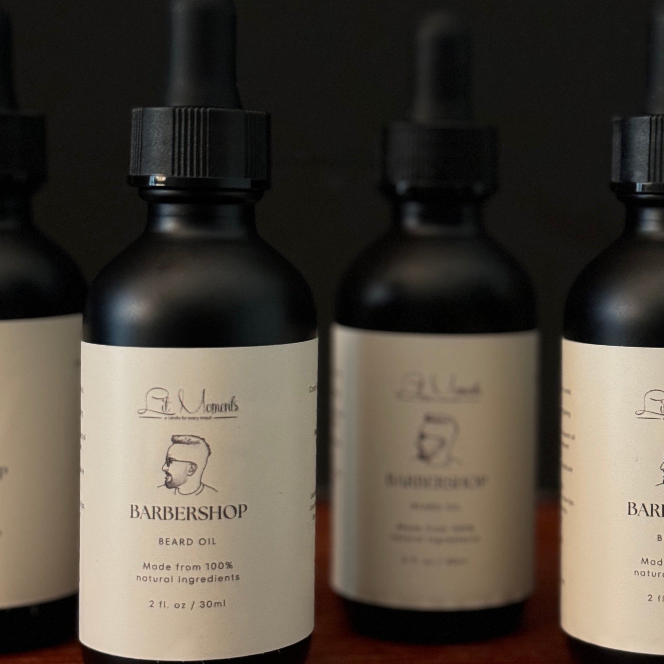 A bottle of Lit Moments' Barbershop Beard Oil, featuring a premium blend of oils to nourish and style, perfect for modern grooming.